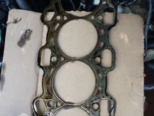 This is the old head gasket, I could not find any specific faults, but the whole gasket looks fried and defected and could have a fault anywhere