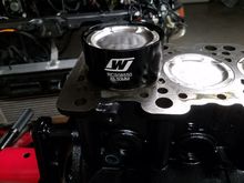 Tapered piston ring compressor