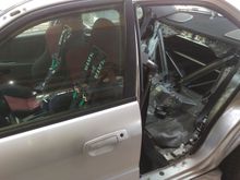 Rear door removed to install first main hoop from the kit. This will be the biggest piece behind the front seats hugging the B pillars 