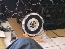 here i test fitted the flywheel  with the old oem flywheel bolts in which  i will use new ones after boring and re conditioning the crank shaft. Got my 4G64 bottom end for $100. Now its stripped totally. lol