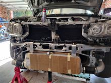 Aftermarket core mocked up - tucks up under bumber upport bracket. Keeps bumper bolt above middle of IC
