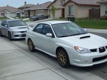 My Evo 8 and Roommate's Subbie
