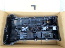 Plastic valve cover (1035A999) removed. So is the stock intake hose's 90° elbow for the 1/2" (12.7mm) breather.