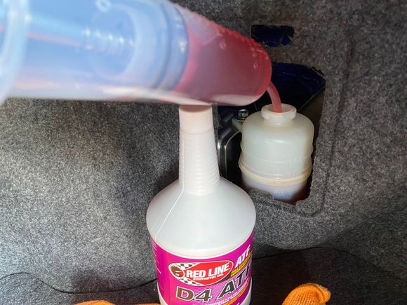 Replacing AYC circuit fluid with an oil syringe. I'm using Redline D4 ATF to avoid damaging the AYC pump in cold winters.