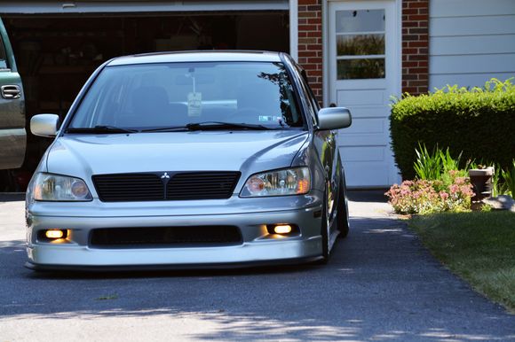 Ok so you guys know what I want the sides and back of the car to look like(mostly stock) and this is what I want the fron to look like(mostly stock also) with the acception of the custom fog lights(wow they look perfect right there!) And also with the acception of the aggressive lowered look. Now personally this is too low for me, but yep this and the previous pic perfectly show the near future of my ES. With the big differences in color though. Mines will be all black :) including the rims.