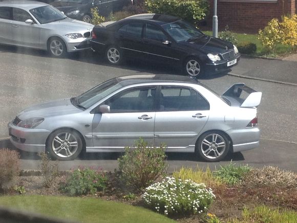 Nice pic of the Lancer after it got its spoiler and VG. Running the OEM 16's.