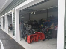 The far right bay which has all the lawn and driveway tools in it as well as my bmw