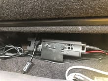 Radio under rear seat