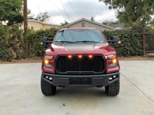 Raptor style grille and bumper with LED flood and spot lights (bumper plastidipped black)