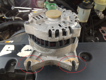 Old Alternator.  Notice the buildup where it is mounted.  It had to negatively impact the ground in some manner.