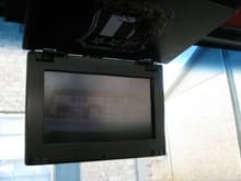 7&quot; custom flip down monitor displaying view from the rear view camera.