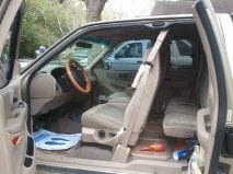 2000 F 150 pic 3, interior, with dealer-service paper floormat, and my empty bottle of 104 Heet, and starting fluid.  Neither of which helped to start the &quot;inert for 3 years&quot; truck, which is why she's at my mechanic's for now.