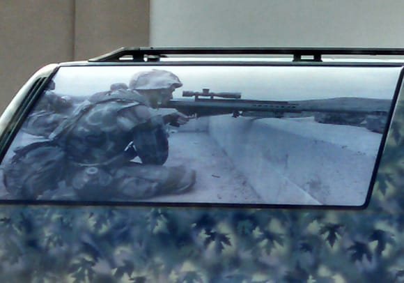 This was just plain cool. The camo pattern looks like maple leaves and theres a very detailed sniper graphic on the window.