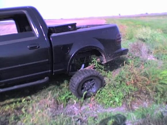 wish you could see the other side it was tucked up pretty.. also this tire is on the ground still no truck rock anything  2 wheel drove it out lol Beast ford for ya!