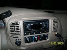 Clarion deck with a small switchplate I made.  I also added my AUX input using RCA connections