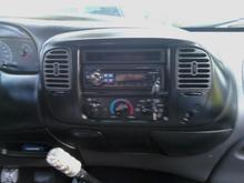 Black radio surround, note the blingin 99cent shifter knob haha.
