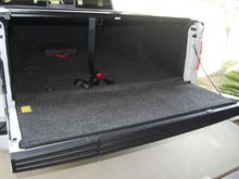Tailgate after removing plastic panel and "Step Assist Pole" and replacing with the panel from the standard tailgate. Flat Tailgate, and bedrug fits.