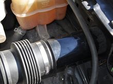 This is my rendition of the El Cheapo intake mod.  It's simply 3" ABS pipe and I ground the end a little to fit through the hole in the inner wall.