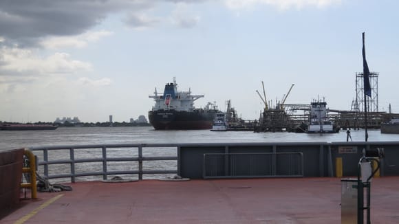 Barges and ships loading and unloading at the refinery.