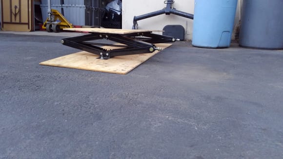 Fuel tank skid plate with dual scissor jack lift system. R.v. jacks hold lots of weight and work well with lifted trucks
