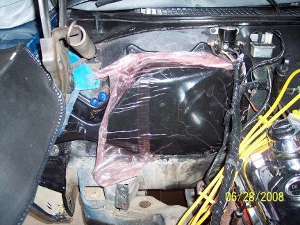 here is the cover installed with the plastic packing still on it. when you are doing this project is a good time to change out your heater core ! might want to think about doing it. make sure to add some sealant between the cover and the firewall. also don't over tighten the cover since it might crack.