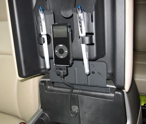 Hidden iPod mounting inside console.