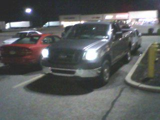 cellphone pic with the halos on. yeah just looks like headlights. camera isnt sensitive enough until you get it really close.