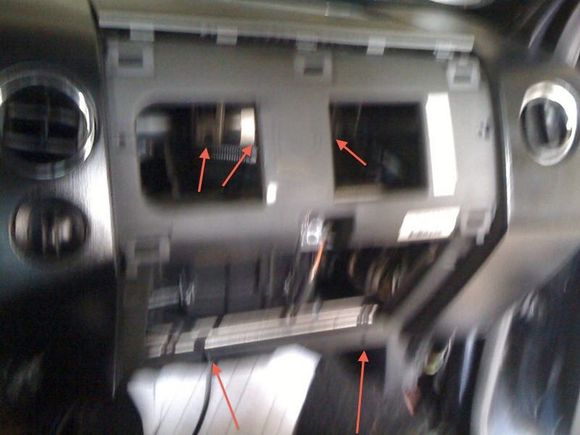 you will have to remove those two screws at the bottom that are attatched to the glove box for it to come out. then it will give you access to the piece above it and i believe there are a couple screws that need to be undone that i cant remember where they are but id check behind it