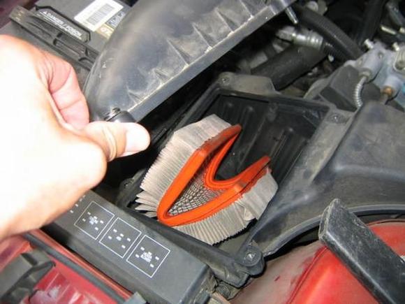 Thanks alot, Jiffy Lube! Detail of air filter installation in my wife's old '97 Sunfire after a trip to the local oil change place. From this point on, I began doing my own oil changes on ALL of my cars!