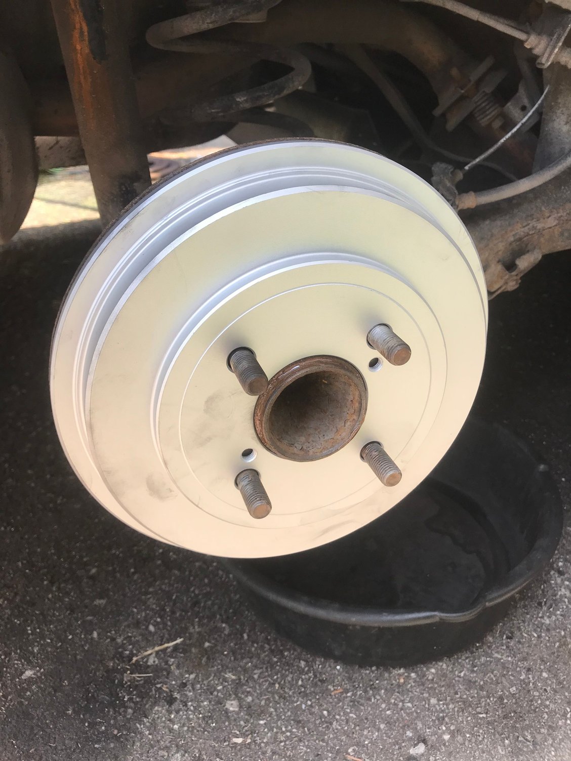 Powerstop Geomet coated drums. Probably due to the coating, when I was adjusting the shoes, no hand brake resulted in slight drag and one click meant impossible to turn by hand. It was possible to turn the wheel with difficultly at 1 click with the wheel on. Easiest adjustment I’ve ever done. The coating inside will likely wear out a bit in the next 100 km of driving. 