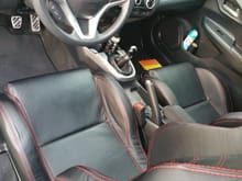 Seats, pedals, and shift knob.