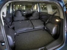 2014 Nissan Versa Note, back seats don't lie flat. The 2015 is identical.