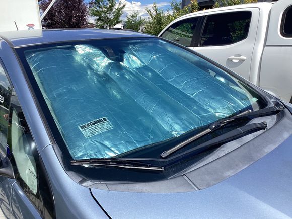 This is a used Heat Shield for Fit, it will help protect your interior from fading due to the sun and lower the temps inside on a sunny day too!
It rolls up to stow and has no cracks. We had this 10 years, and now that we no longer own a Fit we want someone to give this a longer life! Cost, $10 plus shipping.