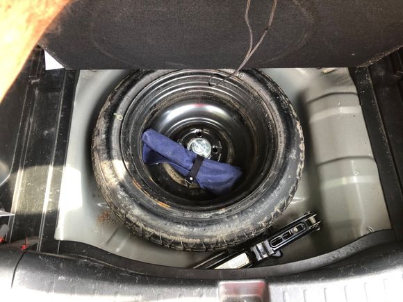 Fits next to the spare inside the compartment.