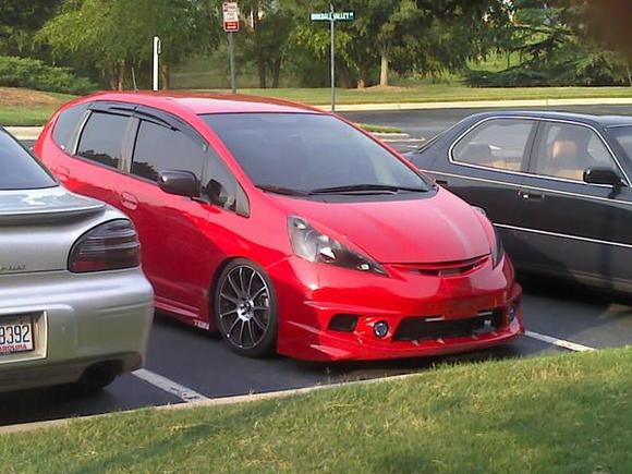 my car the red one 2010 Honda Fit