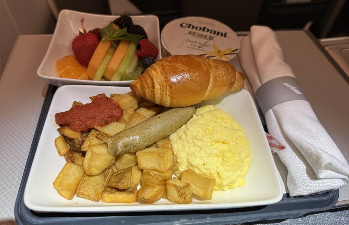 Eggs and accompaniments before landing.  The eggs were quite fluffy.  The fruit bowl was good.