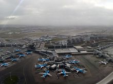 
Dreary day brightened by some KLM  blue and a single ray of sunshine.