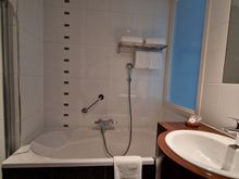 While the (standard) guest rooms only have an open shower, this deluxe room has both a bath and a separate shower (with doors).