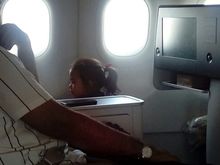Safety is not a priority for this family.
Their child was standing during the take off roll and the crew did not hand out a child restraint.
The mother just picked up the child and held her after I alerted the crew.
Oh well.
