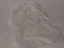 They provide you a plastic bag to temporarily store your mask while eating.