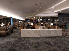 Sparsely populated satellite lounge.