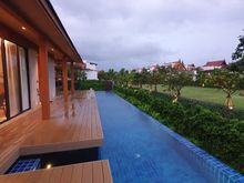 The longer of the two pools looking towards the resort