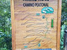 Map shows the road zigzagging through the switchbacks with the hiking trail cutting a swathe straight through to the bottom from the top
