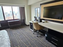 Plenty of space between the bed and desk.  Was wondering if this were an accessible room, although nothing like handles etc. for aiding wheelchair users - just an upper and lower peephole in the door.