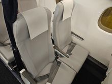 The colour of the new seat is light gray. This is row 2. 