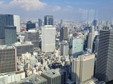 North view towards osaka station. There is a tall building being constructed just across the river with the crane reaching the EL level ( floor 39)