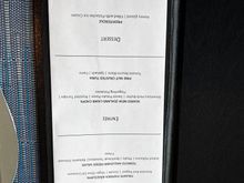 There is no Tuna so they replaced it was salmon. There us no profiterole, just pistachio ice cream. 