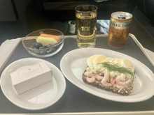 Pre-arrival: smørrebrød with eggs and shrimp, fresh fruit, chocolate