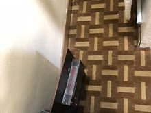Safe screwed to the floor with a single screw, look also how dirty the carpet is 
