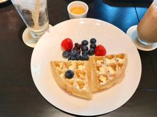 Belgian waffles with blueberries , currants and strawberries 